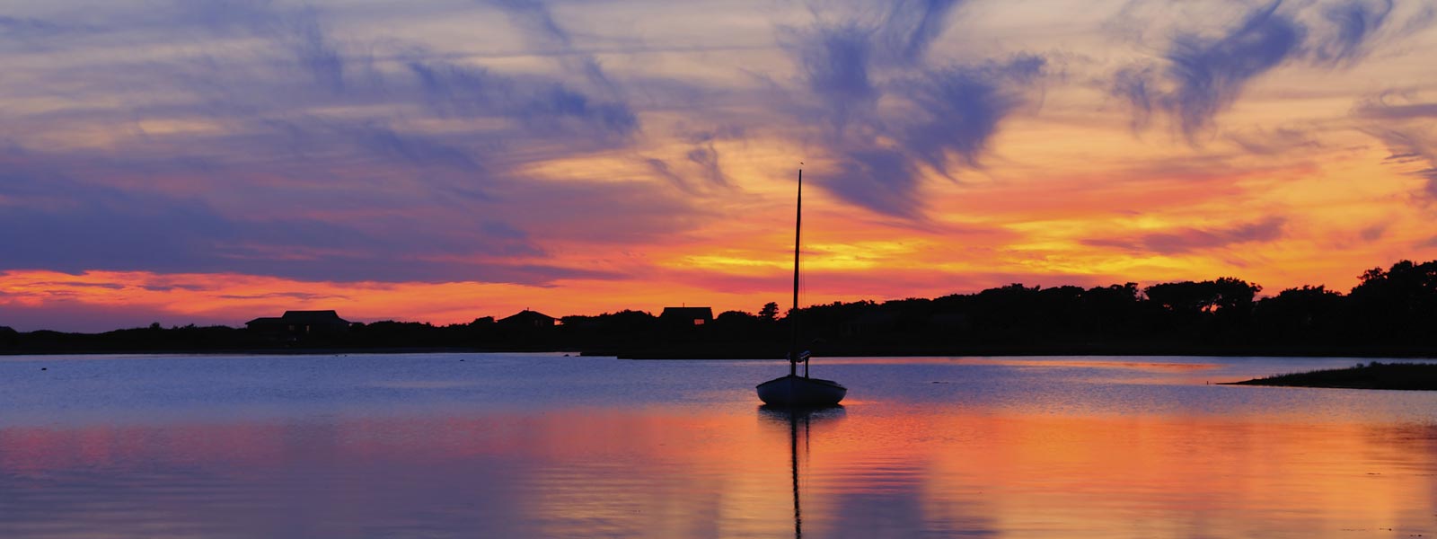 Sail boat at sunset.